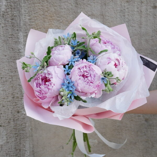 Bouquet of peonies with additives